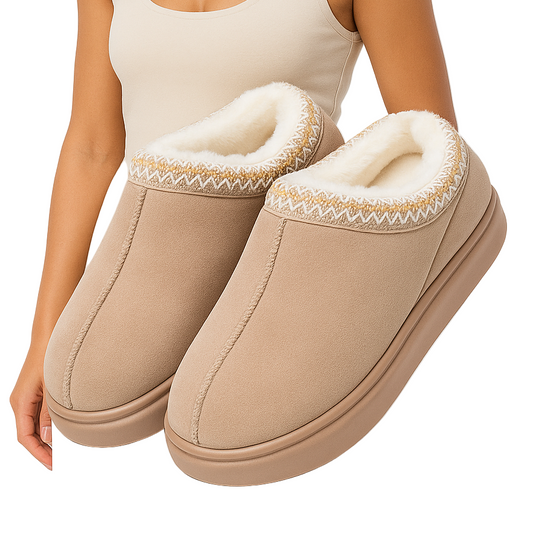 Beige slippers with white fur lining on a white background