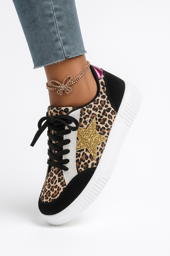 Leopard print sneakers with a white sole worn by a person on a light gray background